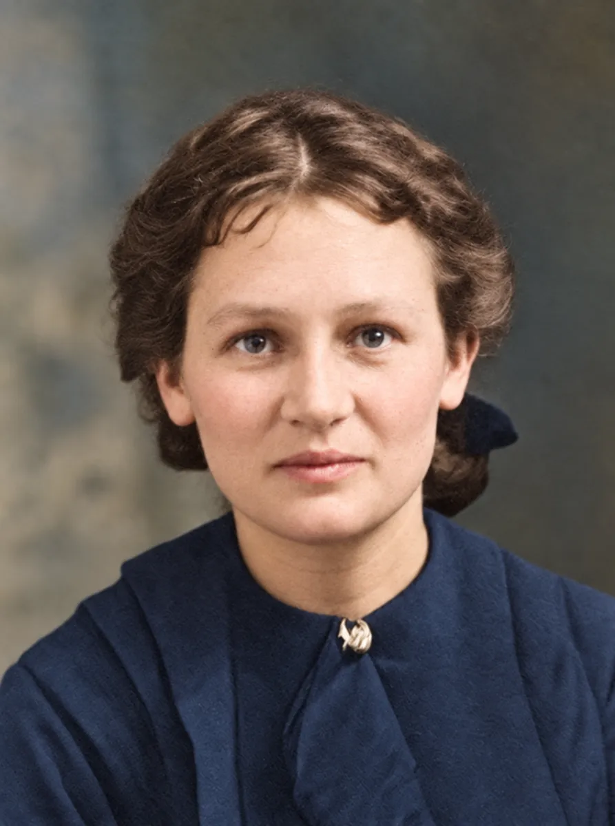 After: black-and-white portrait of a young woman with short curled hair