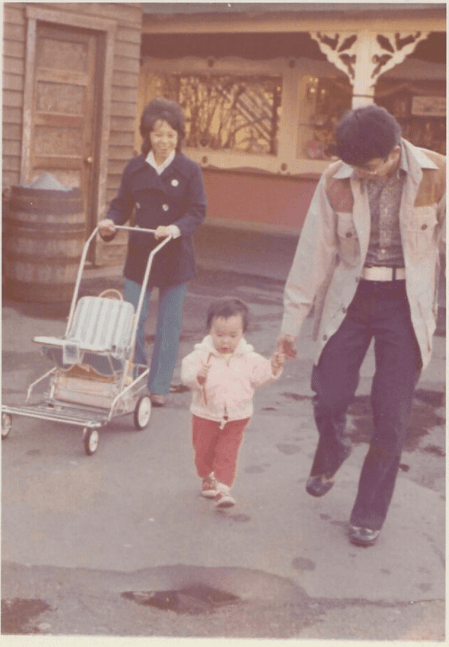 Faded vintage Disneyland snapshot with washed-out color before restoration.